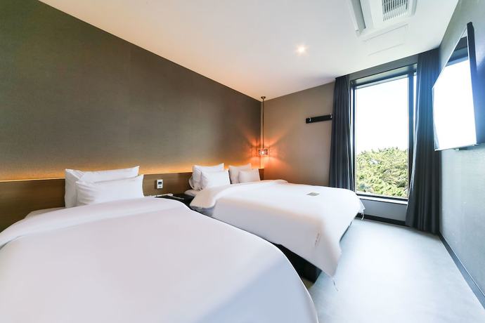 Imagen de la habitación del Hotel Le Idea. Foto 17