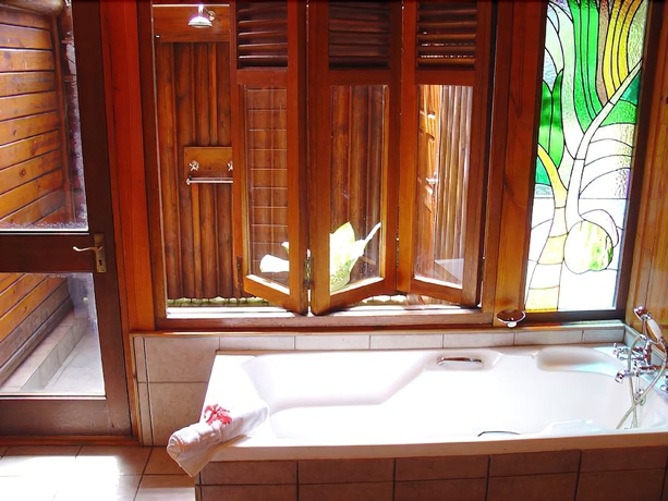 Imagen de la habitación del Hotel Le Jardin Des Palmes. Foto 13