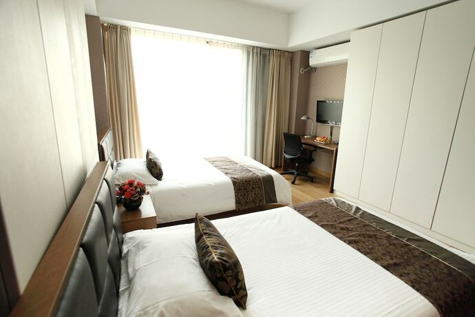 Imagen de la habitación del Hotel Le Jia Xuan International Convention Center Branch. Foto 8
