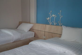 Imagen de la habitación del Hotel Le Lerts Living. Foto 8