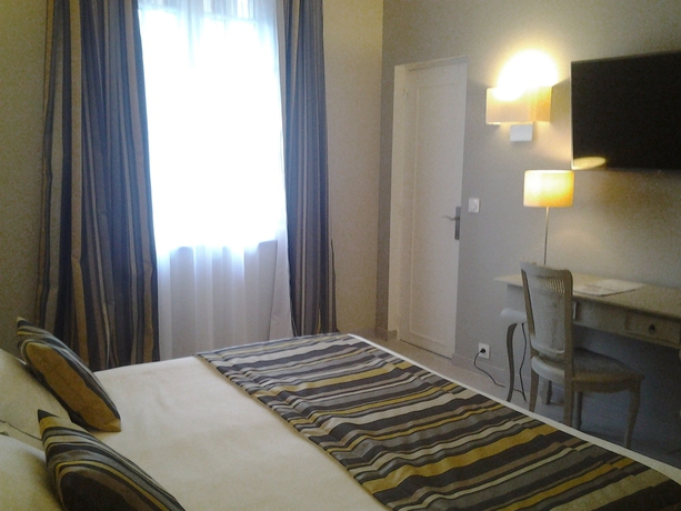 Imagen de la habitación del Hotel Le Lion D'or Et Restaurant La Table Du Lion. Foto 11