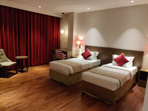 Imagen de la habitación del Hotel Le Lotus Grand Varanasi. Foto 12