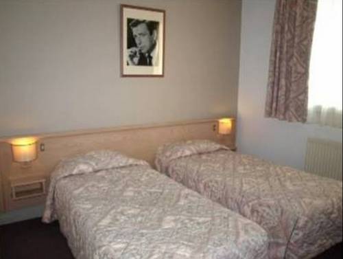 Imagen de la habitación del Hotel Le Lumière. Foto 6