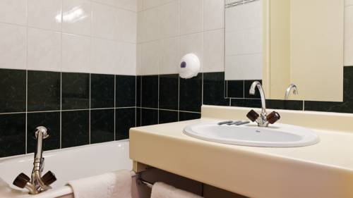 Imagen de la habitación del Hotel Le Lumière. Foto 14