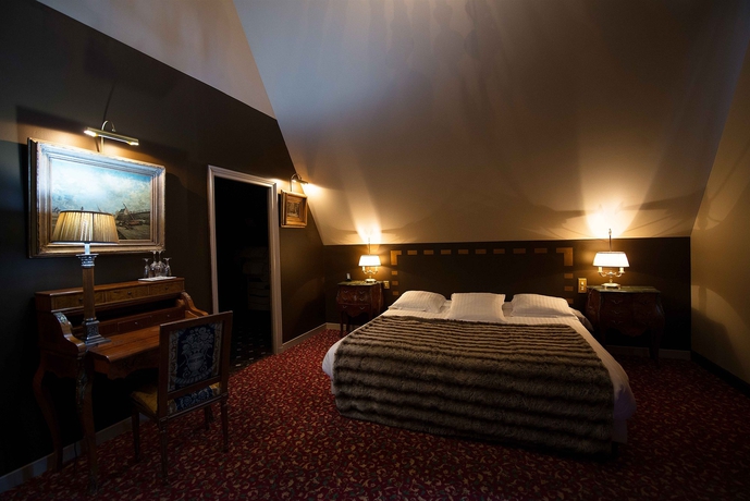Imagen de la habitación del Hotel Le Manoir Des Ducs. Foto 5