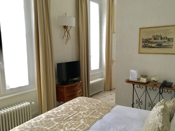 Imagen de la habitación del Hotel Le Manoir Les Minimes. Foto 3