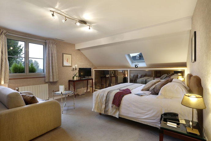 Imagen de la habitación del Hotel Le Manoir Les Minimes. Foto 11