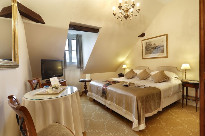 Imagen de la habitación del Hotel Le Manoir Les Minimes. Foto 16