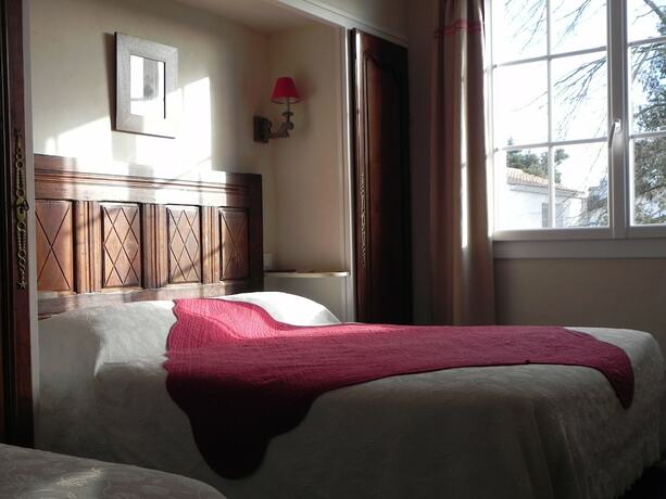 Imagen de la habitación del Hotel Le Manoir de l\'Antiquite. Foto 14