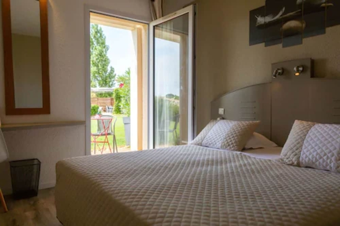 Imagen de la habitación del Hotel Le Mas Des Ponts D'arles. Foto 14