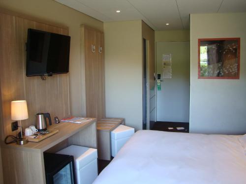 Imagen de la habitación del Hotel Le Mas D'estello. Foto 6