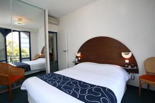 Imagen de la habitación del Hotel Le Mercedes. Foto 5