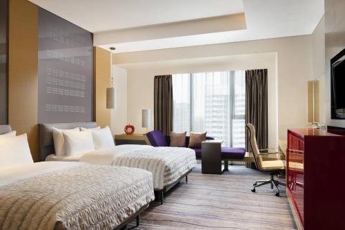 Imagen de la habitación del Hotel Le Meridien Qingdao. Foto 8