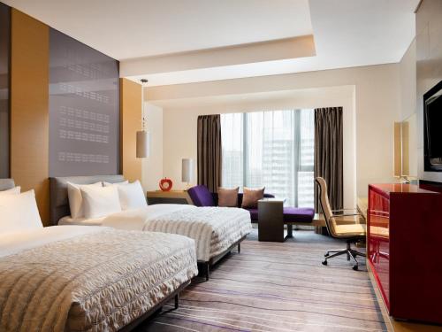 Imagen de la habitación del Hotel Le Meridien Qingdao. Foto 9