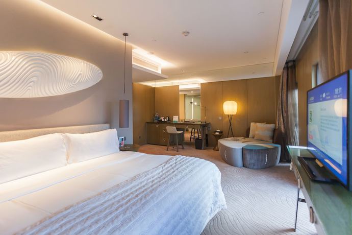 Imagen de la habitación del Hotel Le Meridien Qingdao West Coast Resort. Foto 15