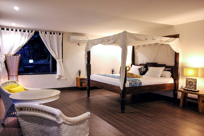 Imagen de la habitación del Hotel Le Mirage Villa Santai. Foto 2