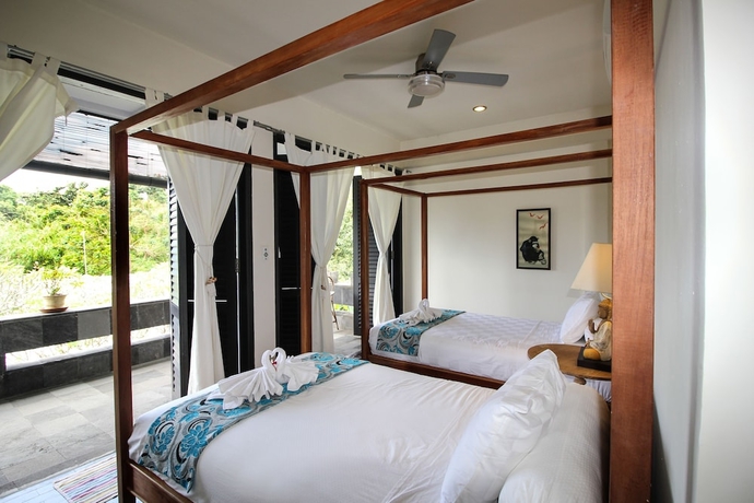 Imagen de la habitación del Hotel Le Mirage Villa Santai. Foto 7