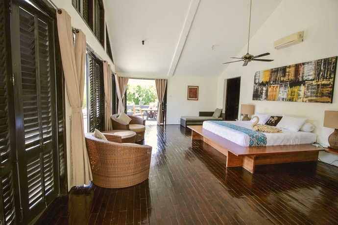 Imagen de la habitación del Hotel Le Mirage Villa Santai. Foto 8