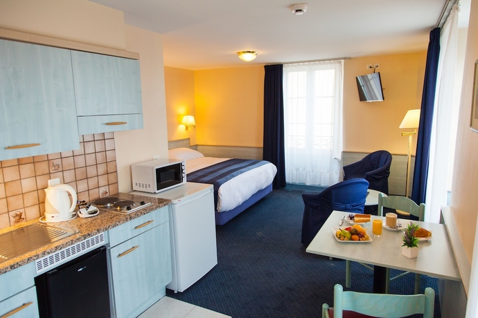 Imagen de la habitación del Hotel Le Montbrillant Residence. Foto 5