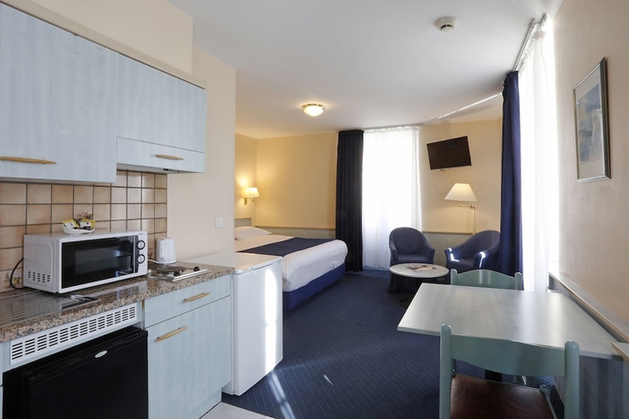 Imagen de la habitación del Hotel Le Montbrillant Residence. Foto 14