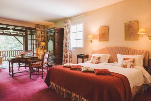 Imagen de la habitación del Hotel Le Moulin Du Roc. Foto 8