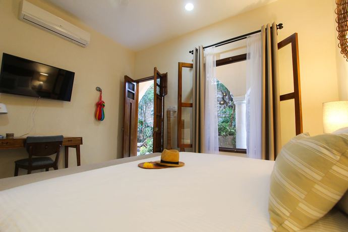 Imagen de la habitación del Hotel Le Muuch. Foto 10