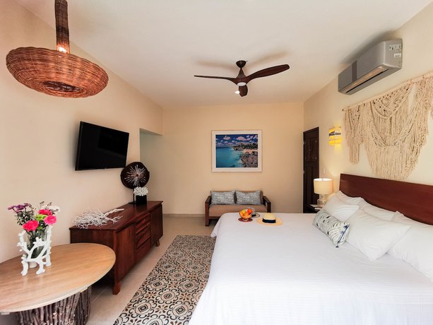 Imagen de la habitación del Hotel Le Muuch. Foto 12