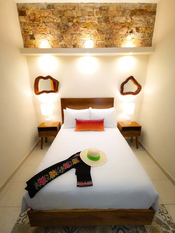 Imagen de la habitación del Hotel Le Muuch. Foto 15