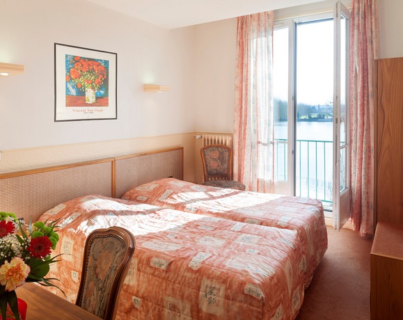 Imagen de la habitación del Hotel Le Normandie. Foto 12
