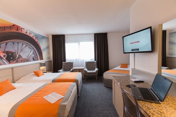 Imagen de la habitación del Hotel Le Paddock. Foto 14