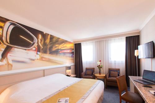 Imagen de la habitación del Hotel Le Paddock. Foto 12