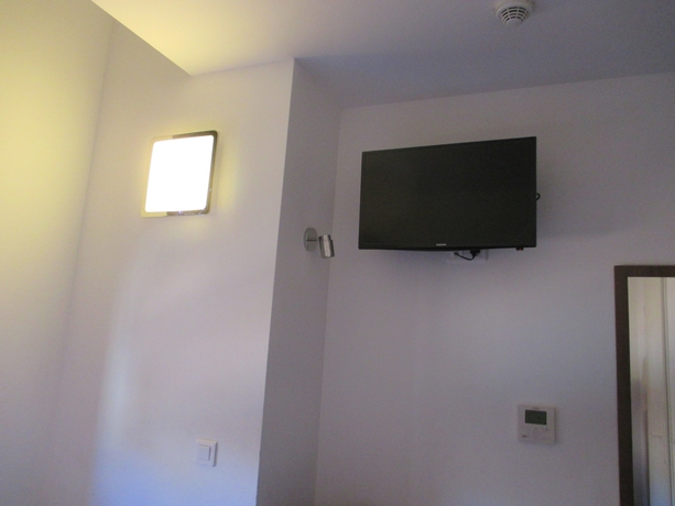 Imagen de la habitación del Hotel Le Pastel. Foto 9