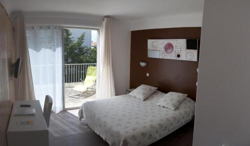 Imagen de la habitación del Hotel Le Pavillon Bleu, Royan. Foto 4