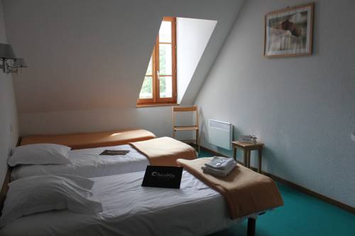 Imagen de la habitación del Hotel Le Pavillon Des Fleurs. Foto 10
