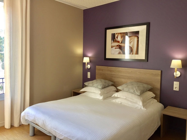 Imagen de la habitación del Hotel Le Petit Castel. Foto 14