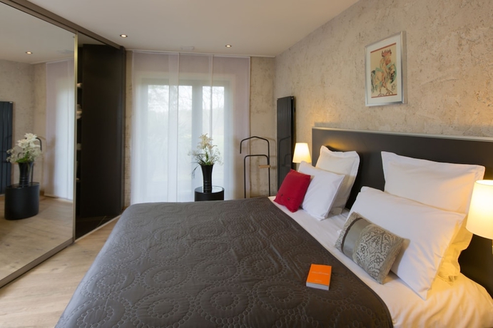 Imagen de la habitación del Hotel Le Petit Coq Aux Champs. Foto 5