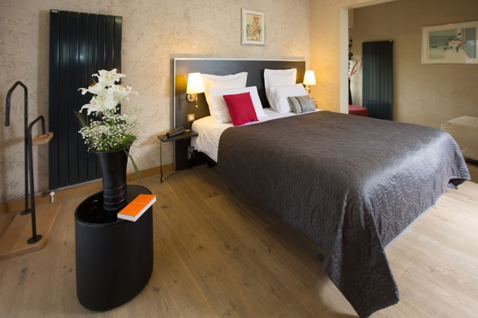 Imagen de la habitación del Hotel Le Petit Coq Aux Champs. Foto 6