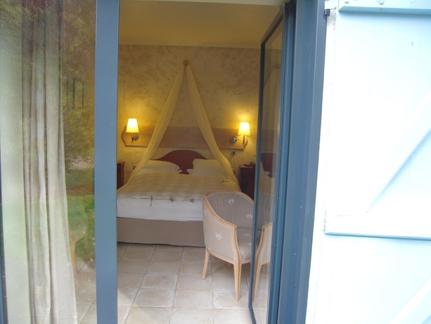 Imagen de la habitación del Hotel Le Petit Coq Aux Champs. Foto 9