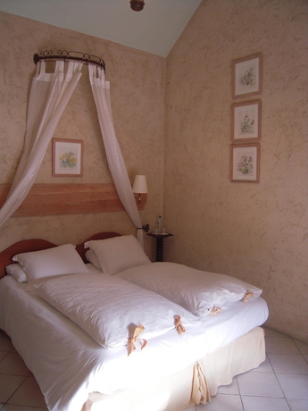 Imagen de la habitación del Hotel Le Petit Coq Aux Champs. Foto 10