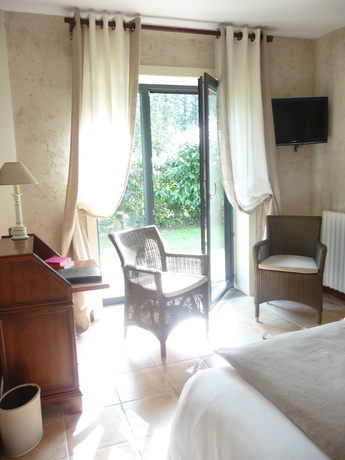 Imagen de la habitación del Hotel Le Petit Coq Aux Champs. Foto 15