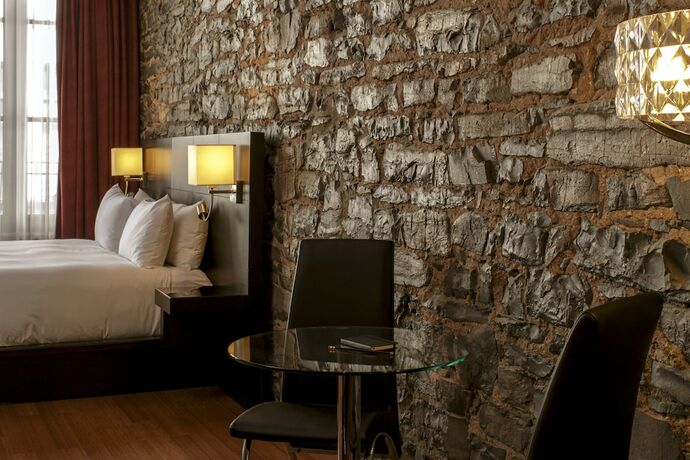 Imagen de la habitación del Hotel Le Petit Notre Dame. Foto 8
