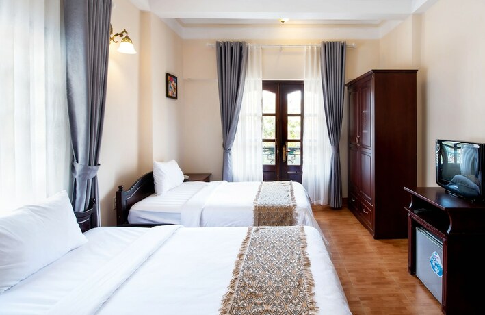 Imagen de la habitación del Hotel Le Petit Paris, Da Lat. Foto 8