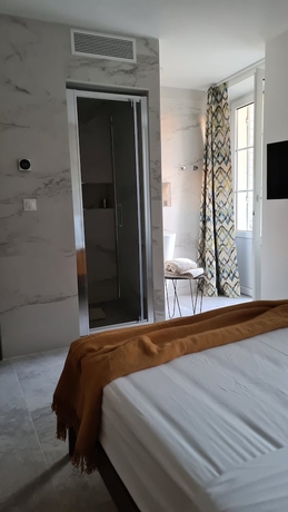 Imagen de la habitación del Hotel Le Petit Trianon Et Le Charme Des Suites. Foto 3