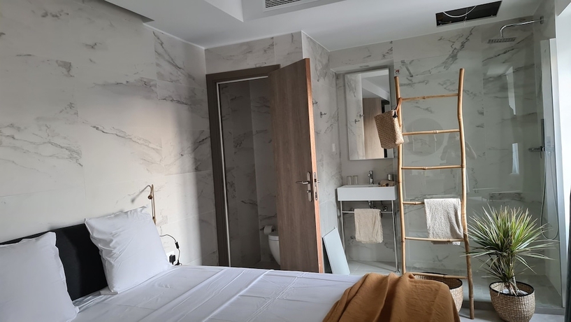 Imagen de la habitación del Hotel Le Petit Trianon Et Le Charme Des Suites. Foto 5