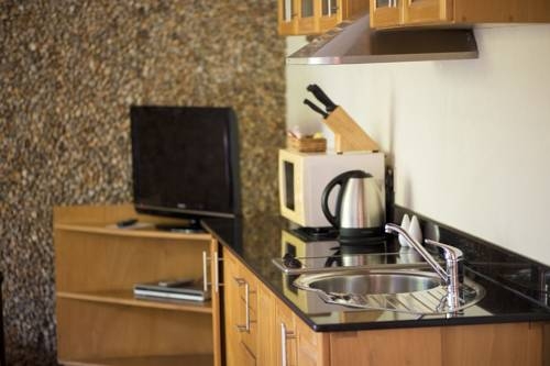 Imagen de la habitación del Hotel Le Petit Village. Foto 8