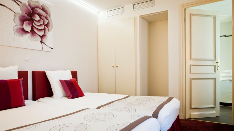 Imagen de la habitación del Hotel Le Phenix. Foto 9