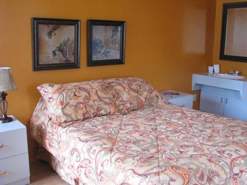 Imagen de la habitación del Hotel Le Pionnier. Foto 13