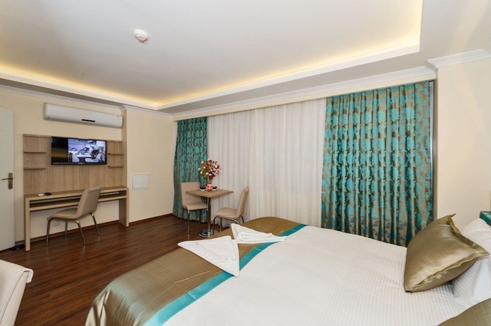 Imagen de la habitación del Hotel Le Premier House. Foto 2