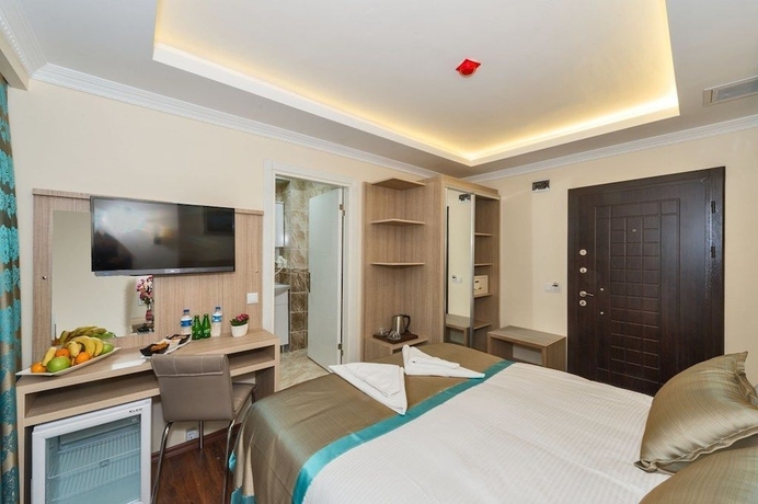 Imagen de la habitación del Hotel Le Premier House. Foto 8