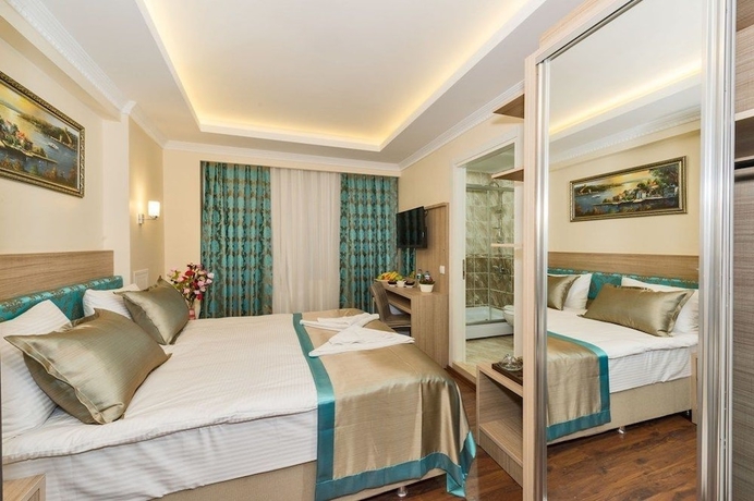 Imagen de la habitación del Hotel Le Premier House. Foto 11